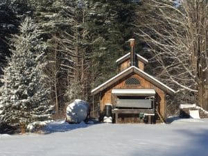 Photo of the snow-covered sugar house at Great Mountain Forest, Norfolk, Connecticut